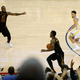 J.R. Smith, No. 5 of the Cleveland Cavaliers, dribbles in the closing seconds of regulation as LeBron James, No. 23, attempts to direct the offense against the Golden State Warriors in Game 1 of the 2018 NBA Finals at Oracle Arena on May 31, 2018, in Oakland, Calif.